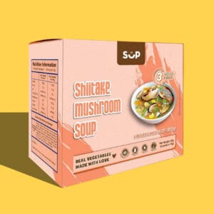 A package of Shiitake Mushroom Soup with "sup" brand logo, featuring images of the soup and nutrition information, set against a yellow background.